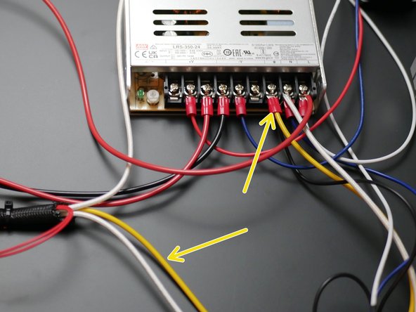 Connect the earth cable top the Earth (E) terminal on the power supply.