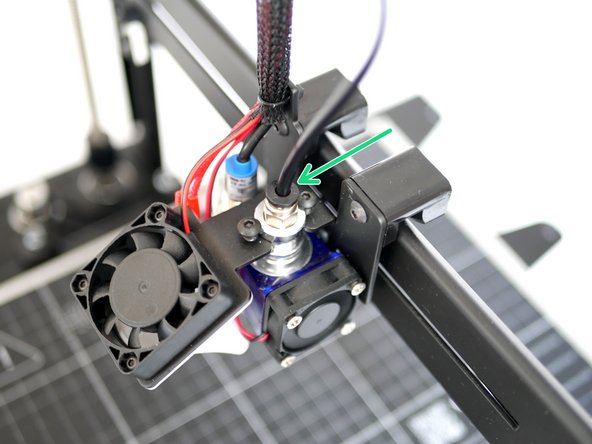 Insert one end of the PTFE tubing to the extruder.