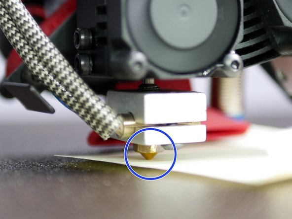 Use a piece of paper to to determine the same amount of friction between the two nozzles and the print surface when switching between hotends.
