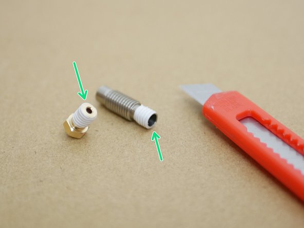 The tape should be wrapped around the shorter part of the thread on the throat.