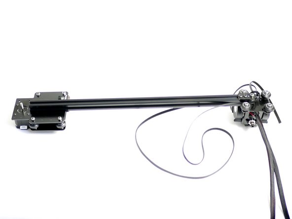 Begin by laying down the gantry and tool carriage assembly like shown in the first image.