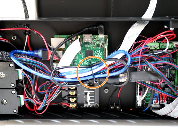 Use a cable tie to bundle together all of the cables.