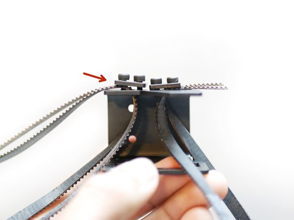 Use the remaining belt clamp to hold the belt in place.