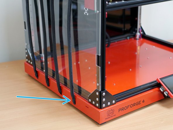 If you are running the default filament sensors, connect their cable to them now and feed them into the braided sleeving.