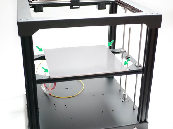 Mount the heated bed to the platform frame.