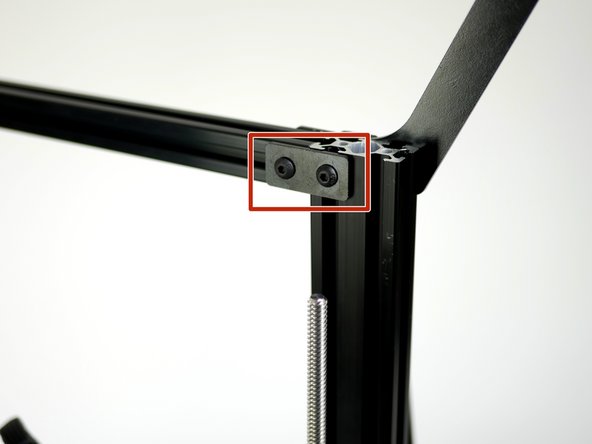 Remove the extrusion bracket from the top corner of the Proforge 2S frame.