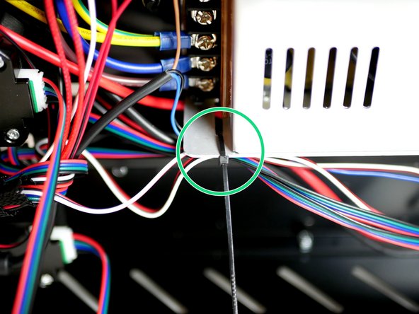 Lay the cables out and cable tie the shorter bunch to the side of the power supply.