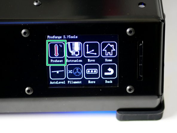 On the touch screen go to Tools -> Preheat and heat the extruder up to 200C.