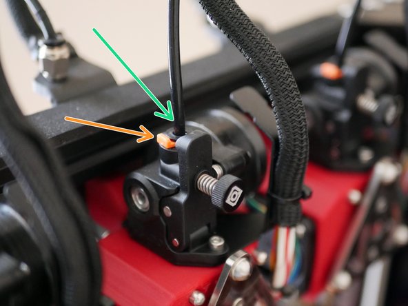 Take the PTFE tube and connect one side to the print head and the other to the coupling on the frame.