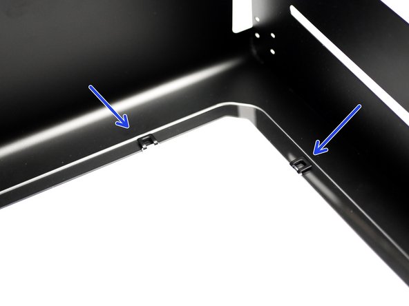 Bend the tabs back down as shown to secure the panel.