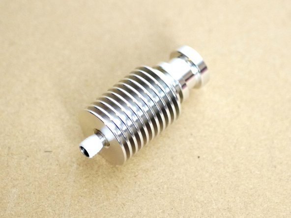 HAND TIGHTEN the Heatsink to the Throat.