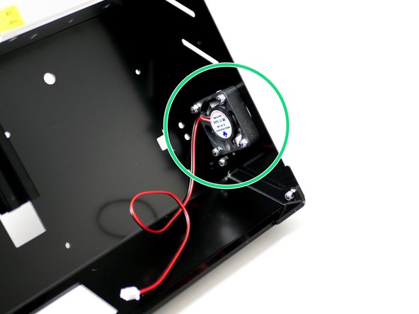 Attach the 40mm electronics fan and fan guard to the side panel with four M3 x 18mm bolts and four M3 nyloc nuts.