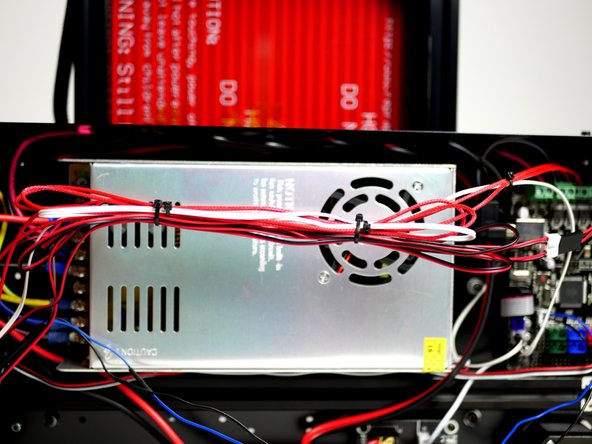 Cable tie the print fan cables to the Hotend cables and tuck away.