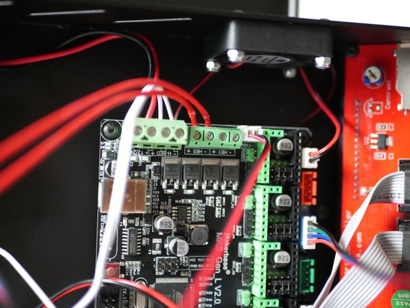Secure the hotend heater cables to the terminals on the control board.