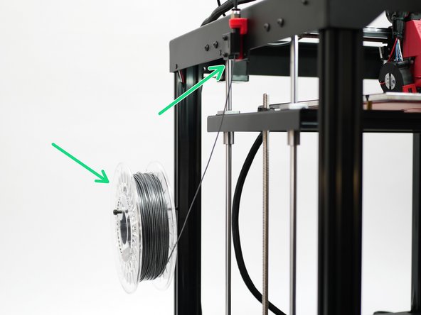 Place the spool onto the spool holder and feed the filament through the filament sensor and up to the extruder.