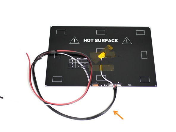 Slide the braided sleeving onto the heated bed cables.