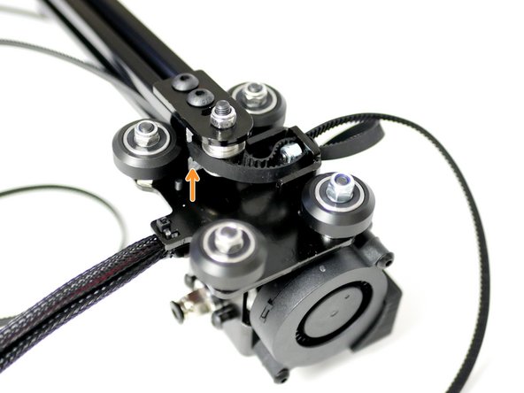 Bring the rollers up to the gantry beam making sure to trap the belt loop in the grooves of the beam with teeth facing inwards.