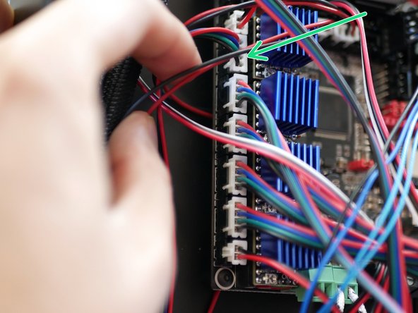 Connect the left sides motor cable to the control board.