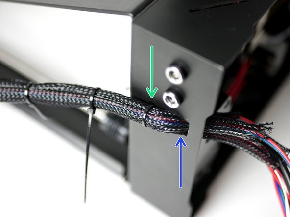 Place the Axis on its side like shown. Use multiple cable ties to create a single branch of cable.