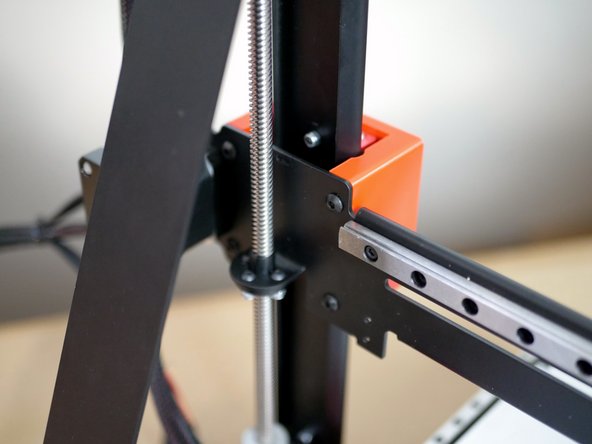 Finally, fix the gantry to the carriage with four M4 x 6mm bolts