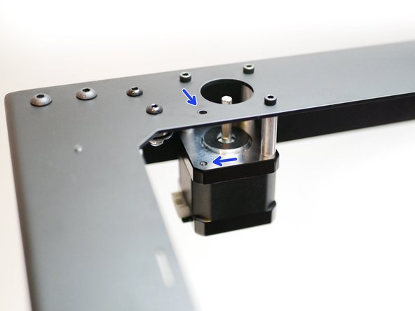 Remove these two bolts and spacers on the motors as shown.