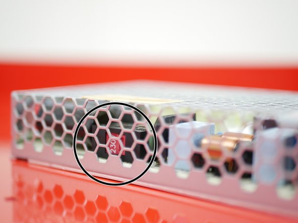 Before mounting the PSU, check that its voltage input is adjusted correctly. The switch on the side of the unit should be set to your mains voltage. For example, in Europe this would likely be 230v, and in North America it would be 110v.