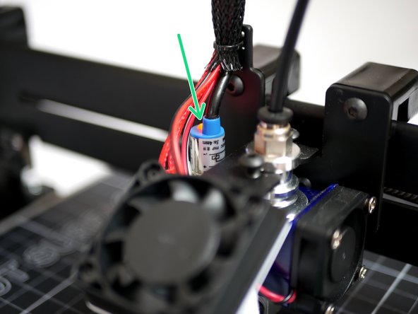 Lower the gantry by hand so that the nozzle comes close to the print surface. Once close enough the red light on the probe should come on before the nozzle hits the print surface.