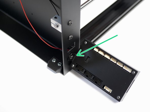Attach the touch screen case assembly to the bottom left of the base of the printer as shown.