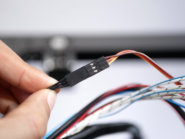 Connect the servo cable to the servo extension cable as shown.