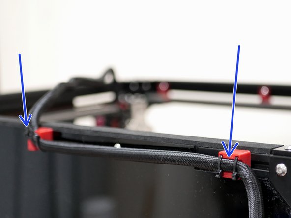Use cable ties to secure the cable loom to the back of the frame.