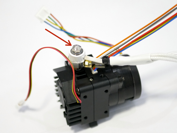 Screw the nozzle into the heater block.