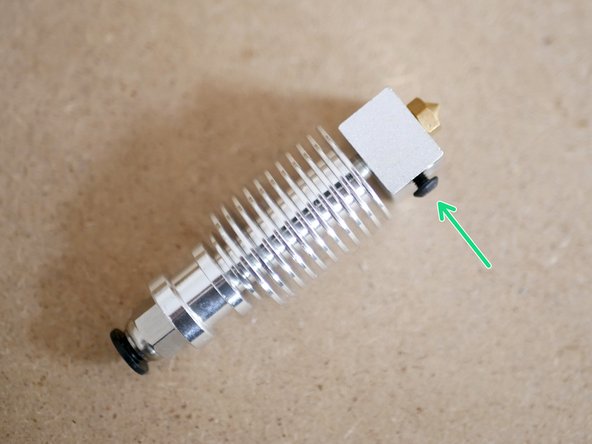 Unscrew the bolt on the side of the heater-block by a few millimetres.