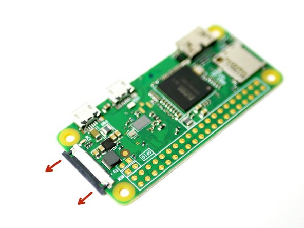 Before mounting the raspberry Pi Zero W, connect to it the golden ribbon cable for the camera.