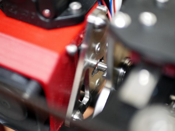 Manually move the tool carriage to a print head and slot the cam head into the tool plate.