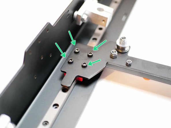 Secure the gantry to the top panel as shown. Note the orientation of the gantry assembly.