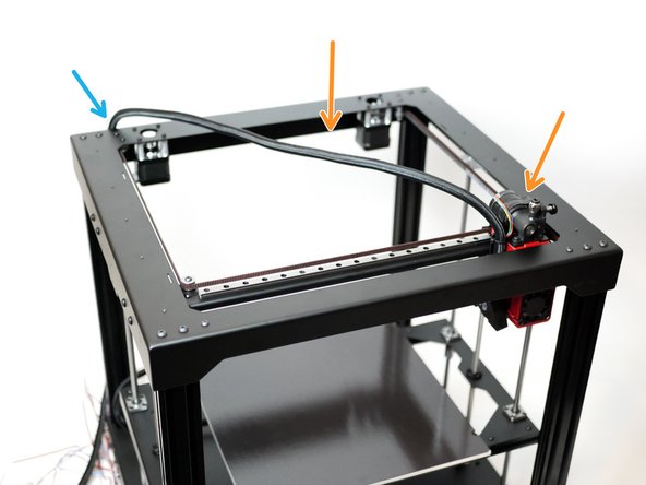 Use two cable ties to secure it to the hotend mount as shown.