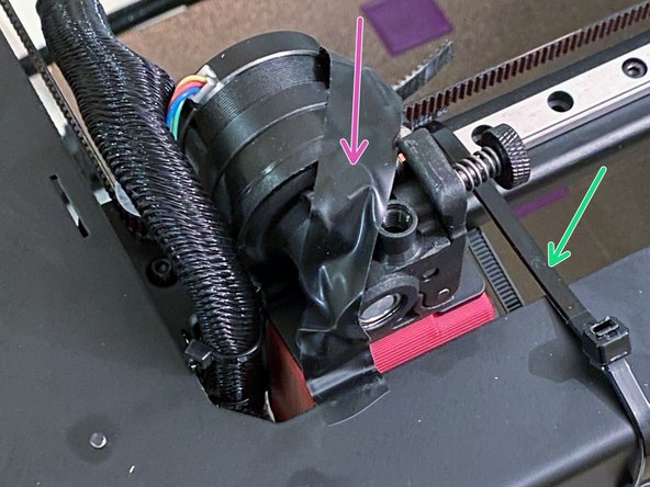 Cut the cable tie and remove the orange stopper from the rail.