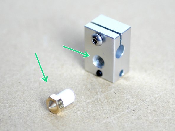 Fix the Nozzle to the Heater Block, it should be screwed into the same side as the set screw.