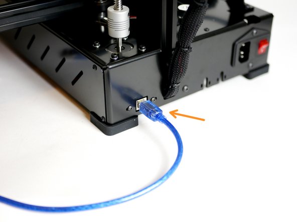 Connect the printer to your computer via the blue USB cable.