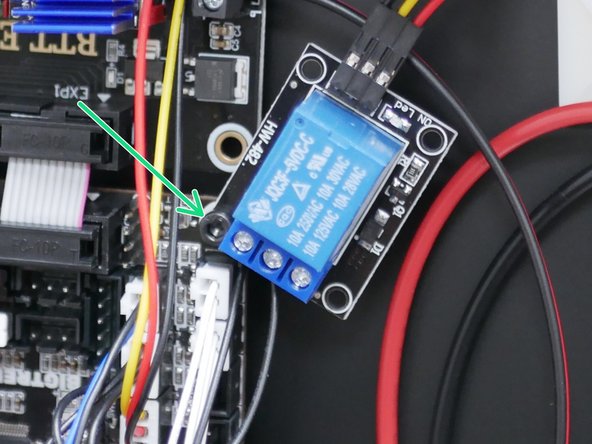 Mount to the top right corner of the control board as shown.