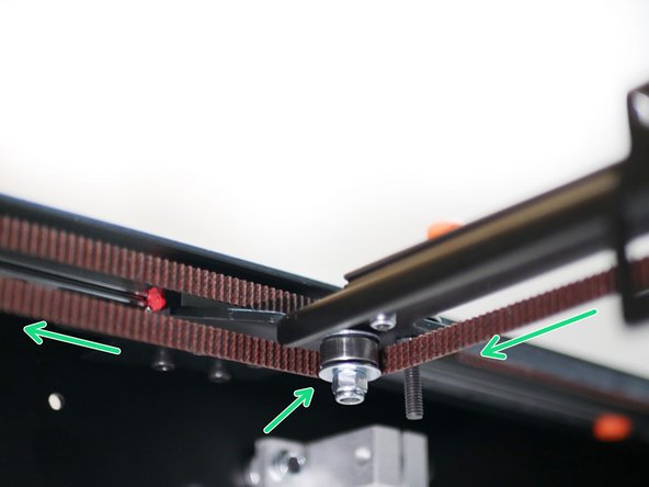 Take the left side of the belt and wrap it around the lower left idler on the gantry as shown.