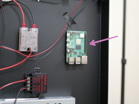 Mount the Raspberry Pi board to the base.