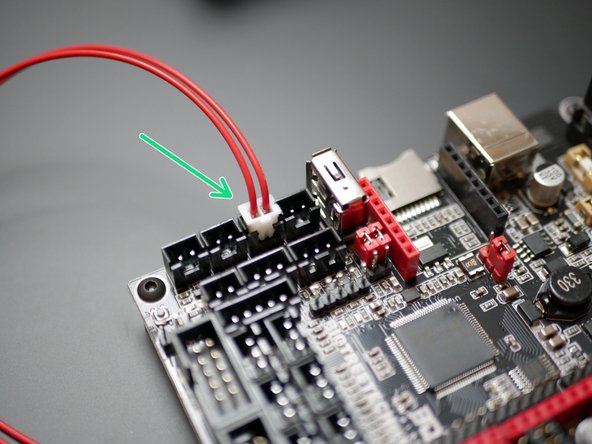 Take the red cable and attach the clamp connector to it.