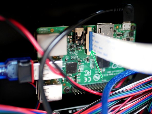 Plug the Pi Cam ribbon cable into the Raspberry Pi like shown.