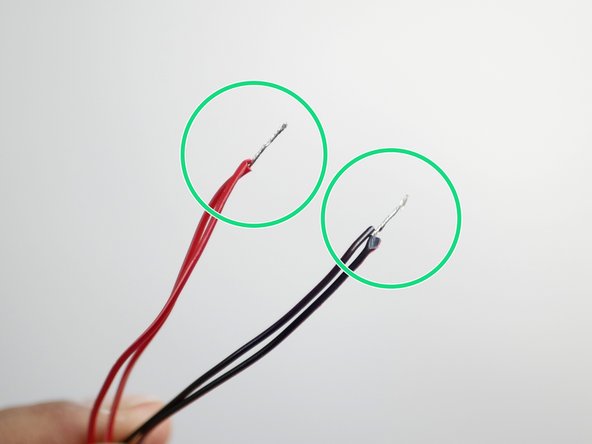 Take the hotend heatsink fan cables and use side cutters, scissors, or wire strippers to remove the connectors from their ends.