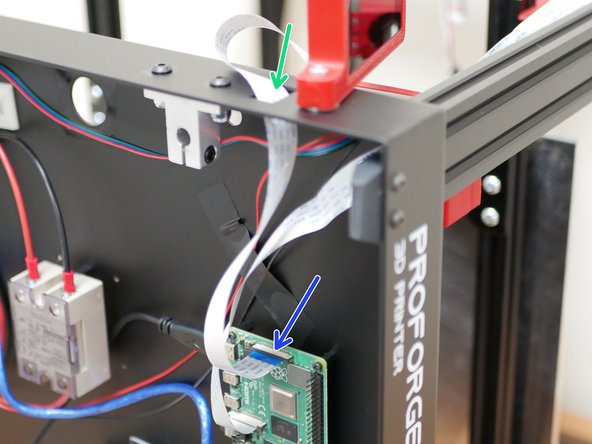 Feed the ribbon cable through the hole on thew side of the base.