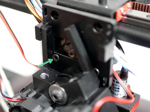 Tighten the two M3 x 8mm bolts. Do this in alternation in order to allow the hotend to rotate out of the way.
