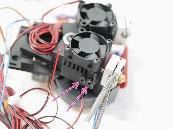 Fix the heater block assemblies in place with two M3 x 12mm bolts. Make sure that the bottom of the heartbreak lines up with the face of the heatsink. The height will be adjusted later to match your print platform.