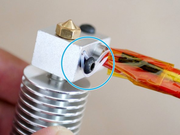 Carefully wrap the thermistor cables around the bolt head.