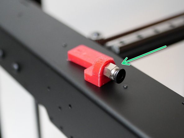 Take the filament sensor mount and fix to it the PC4 Coupling. The coupling can thread straight into it, you will need to use a pair of pliers to turn and secure it.